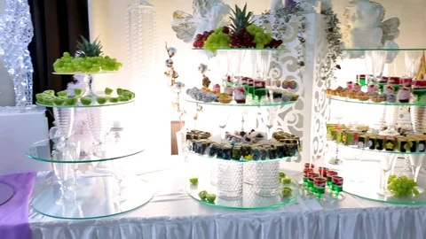 Table with various cookies, tarts, cakes, cupcakes and cakepops.  Buffet table Stock Footage 106450302