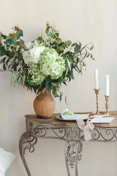 Table With Vase of Flowers Stock Photos