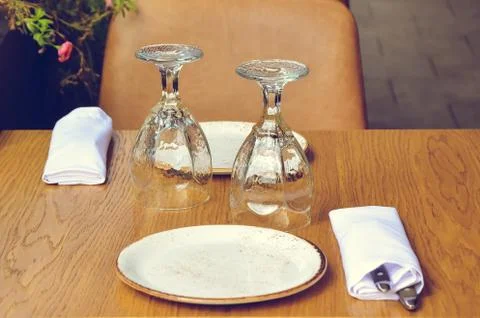 Table on the veranda of the restaurant, served for two Stock Photos