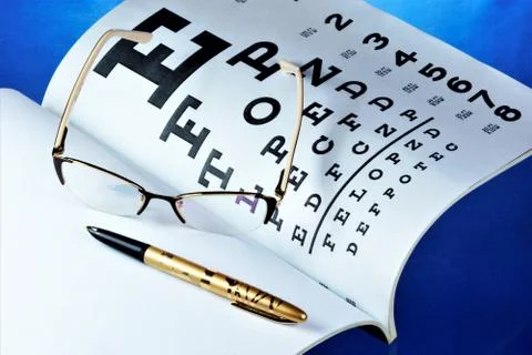 Table of vision testing, glasses, doctor's log. Stock Photos