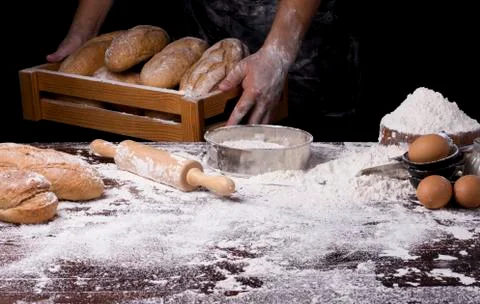 The table was full of bread flour And equipment for making bread And the chef Stock Photos