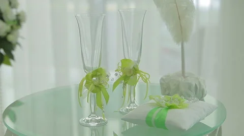 Table with wedding accessories and two glasses Stock Footage 45151700