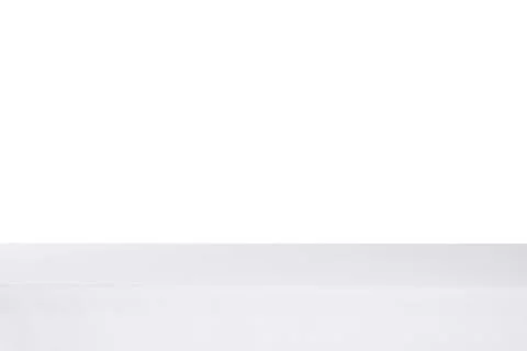 Table with white tablecloth isolated on white Stock Photos