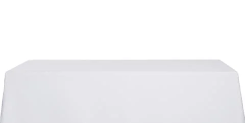 Table with white tablecloth isolated on white Stock Photos