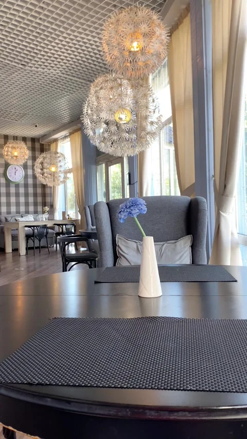 A table by the window in a restaurant. Vertical video Stock Footage 281511884