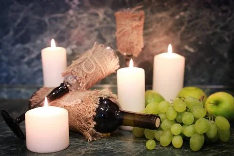 Table with wine bottle grape various vintage elements on old worn backgrou... Foto stock