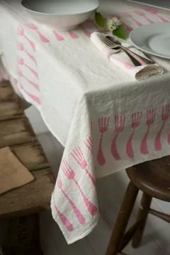 Tablecloth With Fork Design Laid on Table with Dinnerware Stock Photos