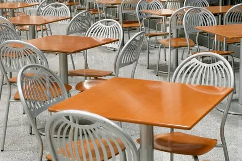 Tables and chairs in an empty cafe or restaurant Stock Photos