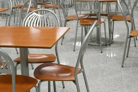 Tables and chairs in an empty cafe or restaurant Stock Photos