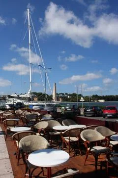 Tables of a bar on the seafront of Brindisi Фото