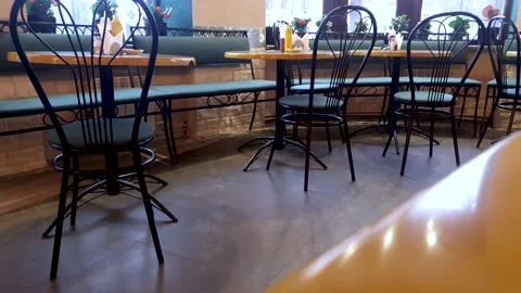 Tables with chairs in the cafe, dining room. Room for eating. Stock Footage 303433291