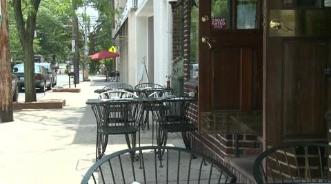 Tables outside a small restaurant Stock Footage 8981333