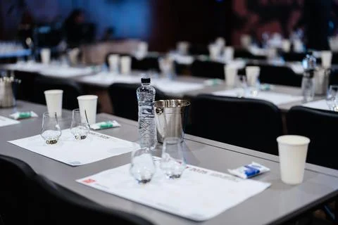 Tables prepared for an engaging event featuring refreshments and drinks Stock Photos