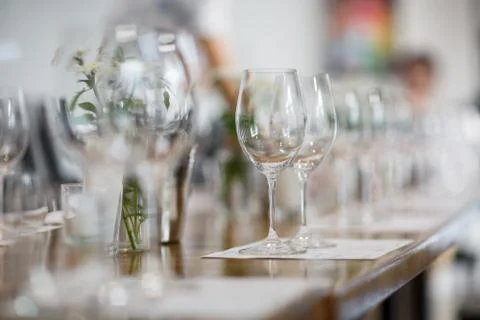 Tables setting at a luxury wedding. Table for guests. Dishes and drinks. Floral Stock Photos