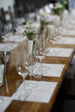 Tables setting at a luxury wedding. Table for guests. Dishes and drinks. Floral Stock Photos