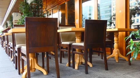 Tables of a street restaurant. Stock Footage 81250934
