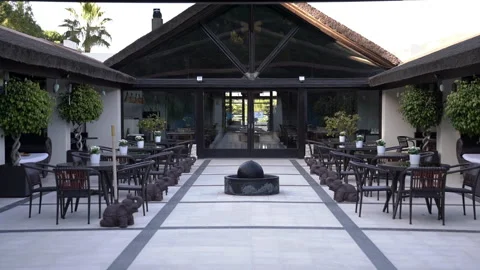 Tables with trees in the villa Stock Footage 281093063