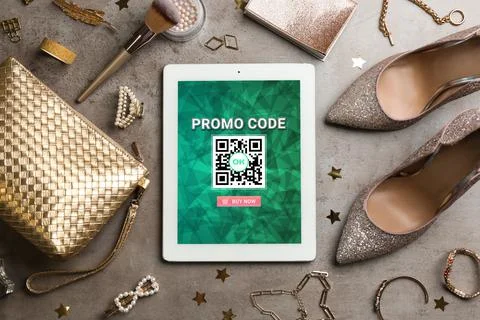 Tablet with activated promo code in online shopping app and stylish accessori Stock Photos