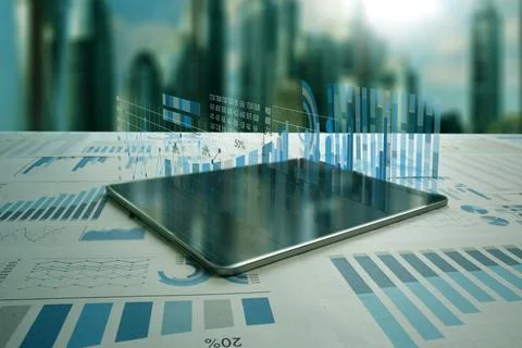 Tablet analyzing data and economic growth graph chart Diagrams projectingci.. Stock Photos
