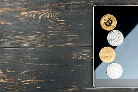 Tablet and bitcoins Stock Photos