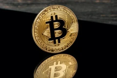 Tablet and bitcoins Stock Photos