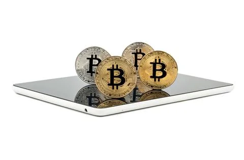Tablet and bitcoins Stock Photos