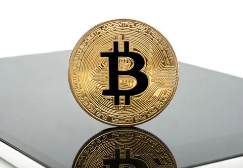 Tablet and bitcoins Stock Photos