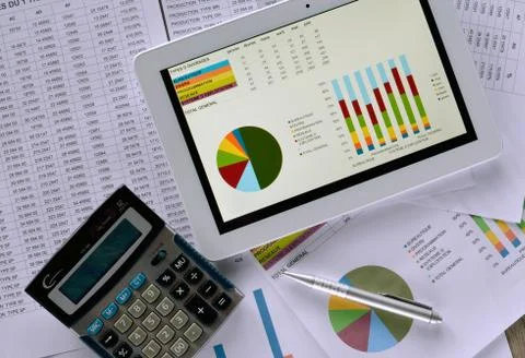 Tablet and a calculator Stock Photos