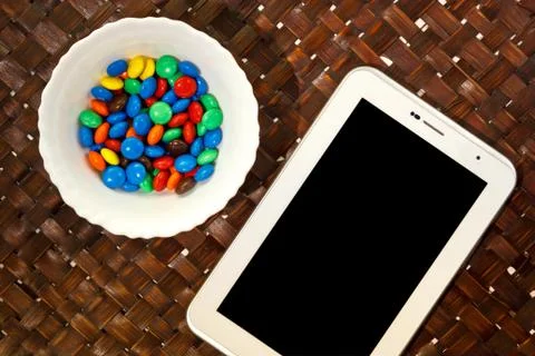 Tablet and candy Stock Photos