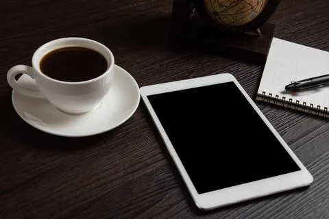 Tablet and coffee cup and blank notebook for memo with pen on wooden backgr.. Stock Photos