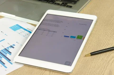 Tablet and graphs Foto stock