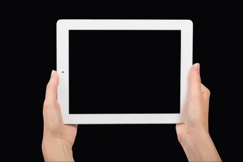 Tablet and Hands on Black Background Stock Photos