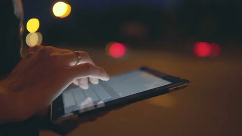 Tablet on the background of car lights Stock Footage 113405403