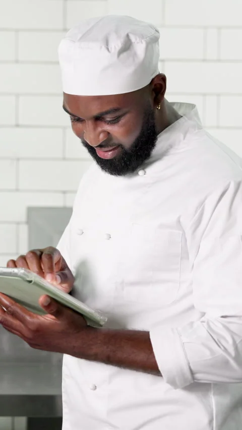 Tablet, black man and chef in kitchen, internet and digital app for recipe, food Stock Footage 327254985