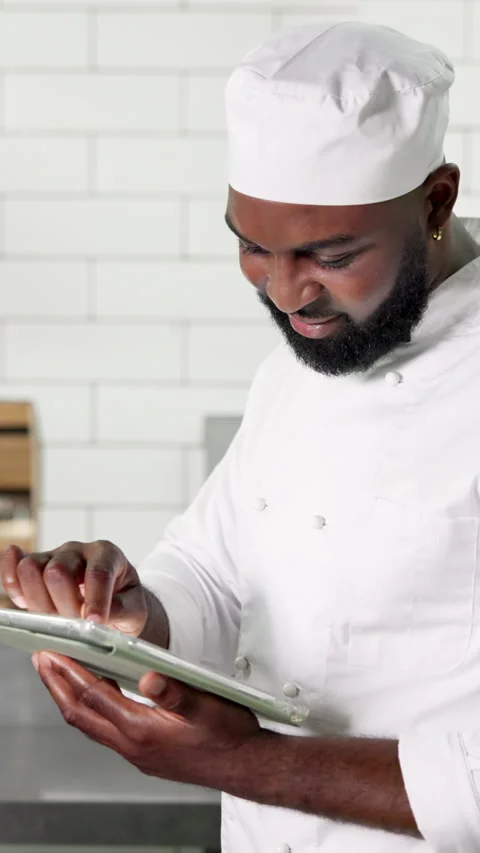 Tablet, black man and chef in kitchen, typing and digital app for recipe, food Stock Footage 327255001