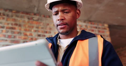 Tablet, black man and problem solving at construction site with engineering app Stock Footage 336215741