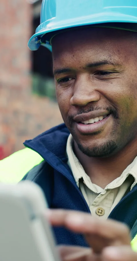 Tablet, black man and smile on construction site with approval for building, Stock Footage 336794212