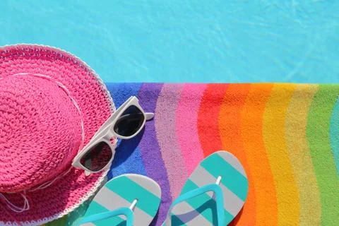 Tablet with blank screen by poolside with beach accessories Stock Photos