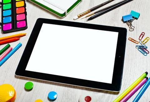 Tablet with blank screen on table with office tools Stock Photos
