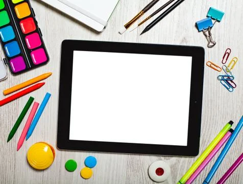 Tablet with blank screen on table with office tools Stock Photos