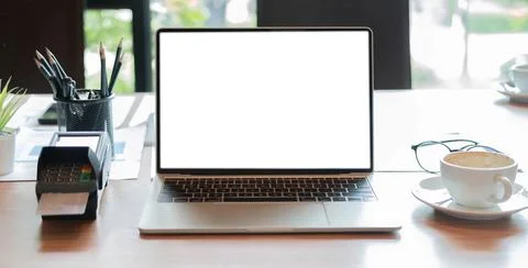 Tablet blank white screen of placed on office table. Mock up. Stock Photos