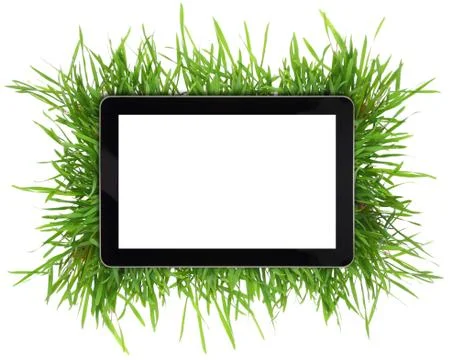 Tablet with blank white screen surrounded by grass isolated Stock Photos