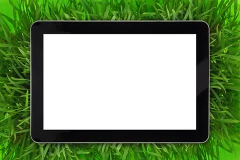 Tablet with blank white screen surrounded by grass Stock Photos