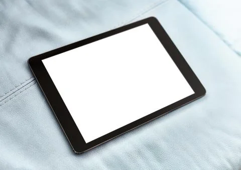 Tablet on blue leather closeup Fotos de archivo