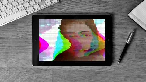 TABLET with blurred pixels hacked face, retro tv distorted screen Stockbeeldmateriaal 119294104