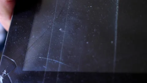 A tablet with a broken screen lies on the ground after a fall 库存影片 303518241