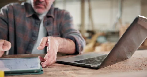 Tablet, carpenter and laptop with hands in workshop for contractor, woodworking Video stock 338315560