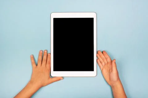Tablet with child's hands Stock Photos
