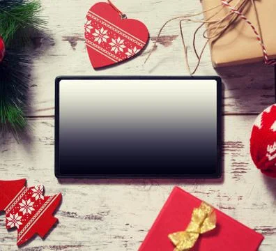 Tablet on Christmas background Stock Photos