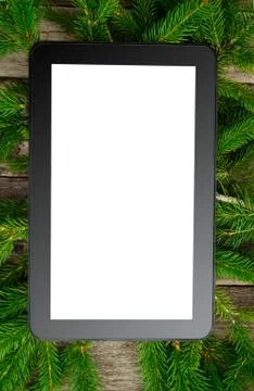 Tablet on christmas tree brunch Stock Photos